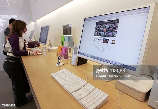 Customers at the Apple Store try out Mac desktop computers July 19, 2006 in San Francisco, California. Apple Computer Inc. Announced that third...