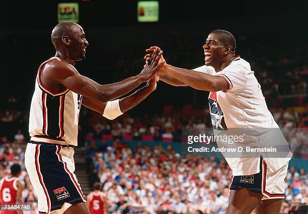 Michael Jordan and Magic Johnson of the United States National Team embrace during the 1992 Summer Olympics in Barcelona, Spain. NOTE TO USER: User...
