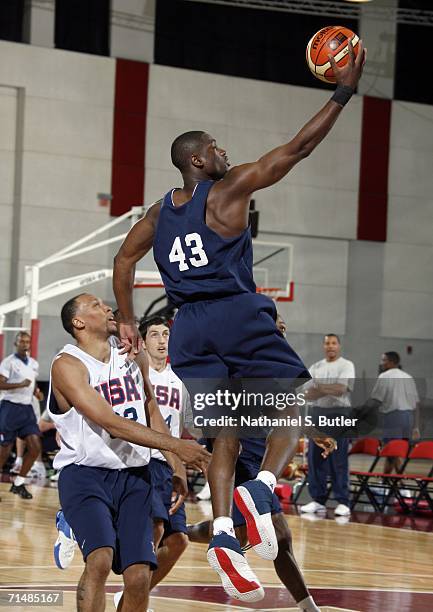 Dwyane Wade goes for a layup against Shawn Marion in a scrimmage during USA Senior Mens National Team practice on July 19, 2006 at the Cox Pavilion...