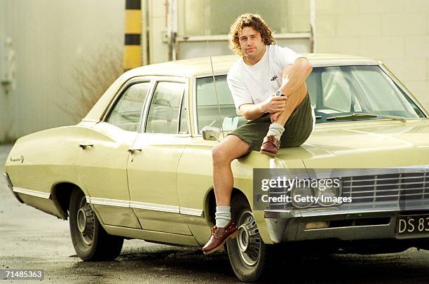 Marc Ellis of the New Zealand All Blacks poses with his Chevy Impala June 26, 1996 in New Zealand. Ellis is a former New Zealand rugby league and...