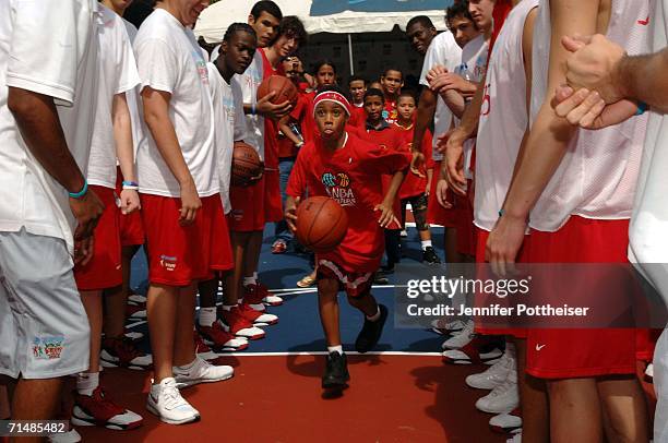 School children from Escuela Elemental Juan B. Huyke joined campers from the Basketball Without Borders Americas program to celebrate the opening of...