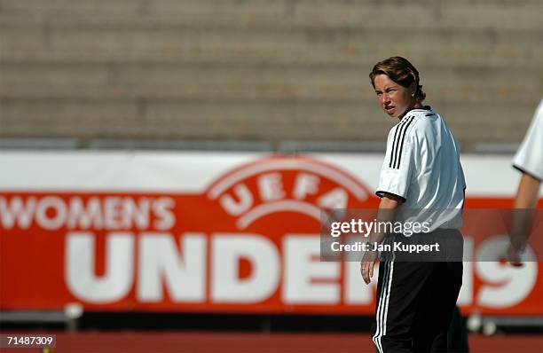 Coach Maren Meinert of Germany looks on during the Women's U19 European Championship Semi Final between Germany and Russia at Stadium Neufeld on July...