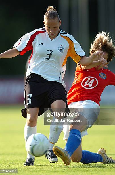 Liubov Bukashkina of Russia tackles Monique Kerschowski of Germany during the Women's U19 European Championship Semi Final between Germany and Russia...