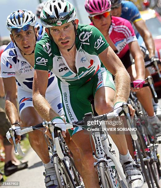 Saint-Jean-de-Maurienne, FRANCE: Belgium's Philippe Gilbert , France's Patrice Halgand and Germany's Patrick Sinkewitch ride together during the...