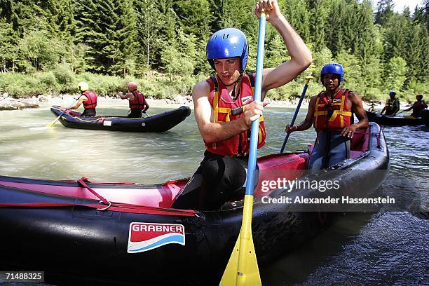 Rafael van der Vaart and his team mate Nigel de Jong of Hamburg SV takes part in a white-water rafting tour on the Saalbach River on July 20, 2006 in...