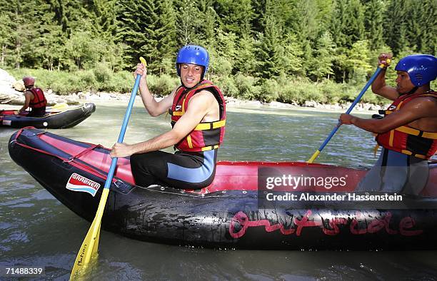 Rafael van der Vaart and his team mate Nigel de Jong of Hamburg SV takes part in a white-water rafting tour on the Saalbach River on July 20, 2006 in...