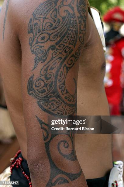 Tatoo detail on the body of an Ocean Pacific Islander performer is observed during the opening of 'Paris Plage' 2006 on July 20, 2006 in Paris,...