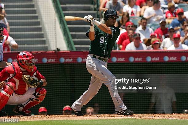 Infielder Tomas Perez of the Tampa Bay Devil Rays swings at a Los Angeles Angels of Anaheim pitch on June 16, 2006 at Angel Stadium in Anaheim,...