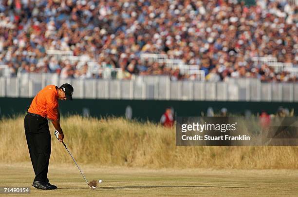 Tiger Woods of USA hits his approach shot to the 18th green during the first round of The Open Championship at Royal Liverpool Golf Club on July 20,...