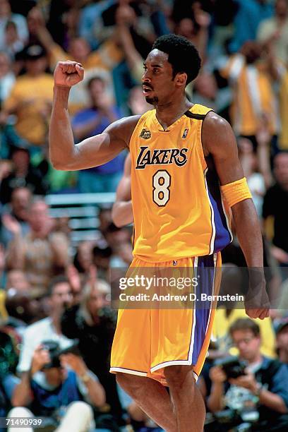 Kobe Bryant of the Los Angeles Lakers pumps his fist against the Indiana Pacers during Game Six of the 2000 NBA Finals on June 19, 2000 at the...