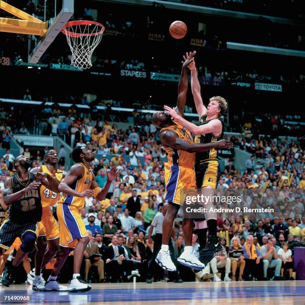 Rick Smits of the Indiana Pacers attempts a shot against Shaquille O'Neal of the Los Angeles Lakers during Game Six of the 2000 NBA Finals on June...