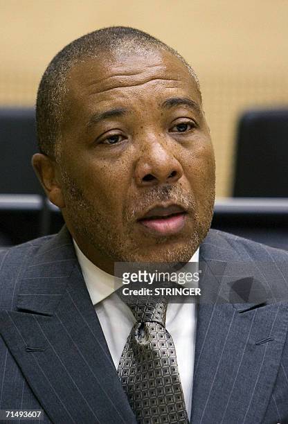 Den Haag, NETHERLANDS: Former Liberian President Charles Taylor appears in court 21 July 2006 as the tribunal prosecuting war crimes from Sierra...