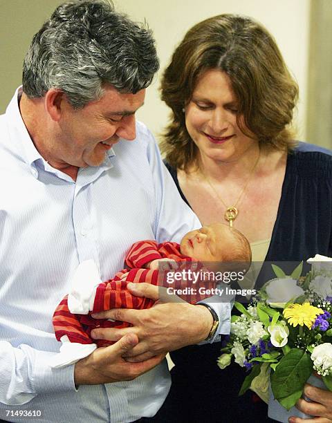 Chancellor of the Exchequer, Gordon Brown, poses as he leaves Edinburgh Royal Infirmary with his wife, Sarah and new baby boy, James Fraser Brown,...