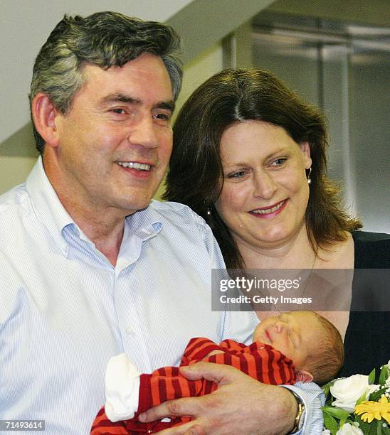 Chancellor of the Exchequer, Gordon Brown, poses as he leaves Edinburgh Royal Infirmary with his wife, Sarah and new baby boy, James Fraser Brown,...