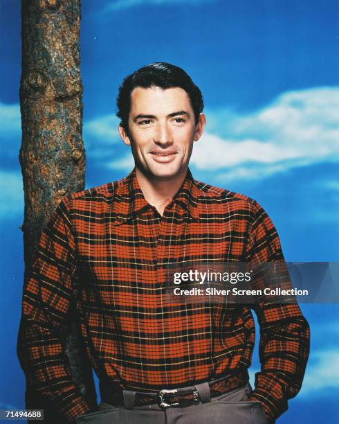American actor Gregory Peck in a plaid shirt, circa 1950.