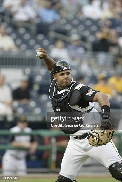 Catcher Ronny Paulino of the Pittsburgh Pirates throws to first base during a game against the Washington Nationals at PNC Park on July 14, 2006 in...