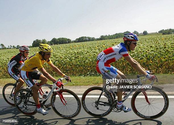 Spain's Oscar Pereiro Sio rides with his teammates France's Florent Brard and Spain's David Arroyo Duran during the 197 km eighteenth stage of the...