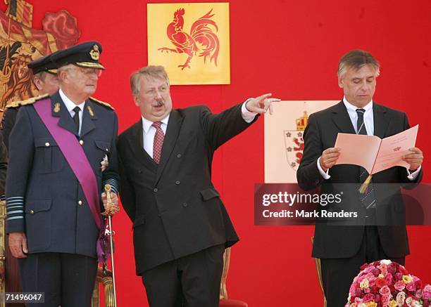King Albert of Belgium, Defence Minister Andre Flahaut and Interior Minister Patrick Dewael attend Belgian National Day celebrations on July 21, 2006...
