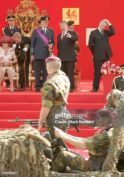 King Albert of Belgium, Defence Minister Andre Flahaut and Interior Minister Patrick Dewael attend Belgian National Day celebrations on July 21, 2006...