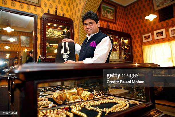 Jeweller Munnu Kasliwal the owner of Gem Palace jewelley store showing precious and semi-precious stones worth millions of dollars on January 9, 2006...