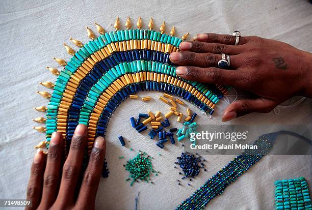 Workers at the Gem palace work shop working with precious and semi-precious stones on January 9, 2006 in Jaipur, India. Jaipur is famous for its...