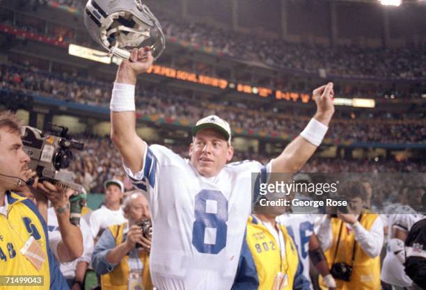 Quarterback Troy Aikman of the Dallas Cowboys celebrates their victory over the Buffalo Bills in Super Bowl XXVIII at the Georgia Dome on January 30,...