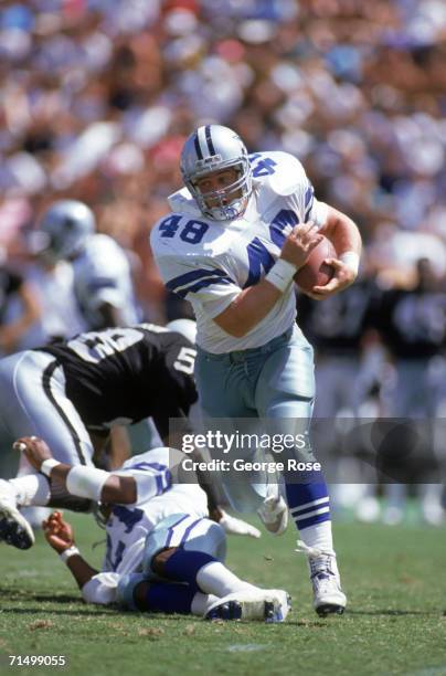 Full back Daryl Johnston of the Dallas Cowboys rushes for yards during a preseason game against the Oakland Raiders at Oakland/Alameda County...