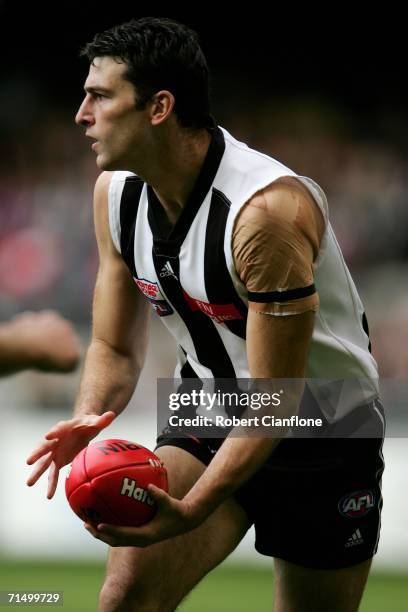 Simon Prestigiacomo of the Magpies in action during the round 16 AFL match between the Collingwood Magpies and the West Coast Eagles at the Telstra...