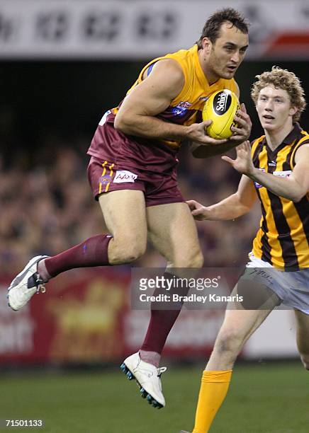 Daniel Bradshaw of the Lions wins the contest to the ball during the round 16 AFL match between the Brisbane Lions and the Hawthorn Hawks at the...