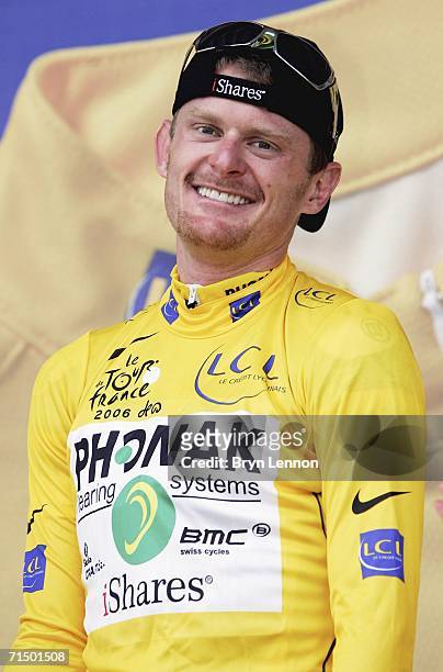 Floyd Landis of the USA and Phonak celebrates taking the yellow jersey on the penultimate stage of the 93rd Tour de France, an individual time trial...
