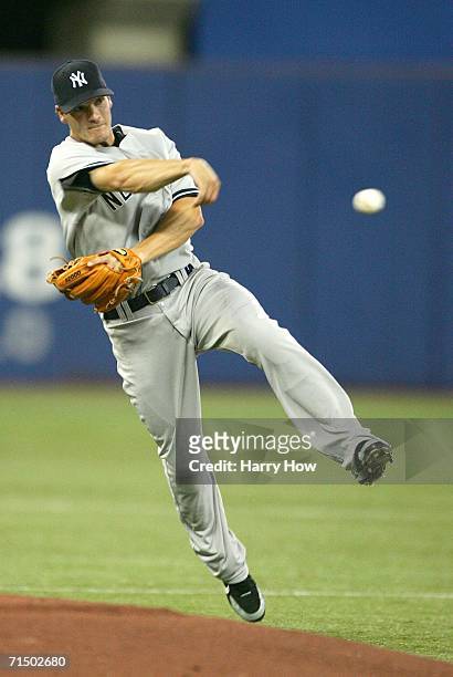 Nick Green of the New York Yankees makes a running throw to first for an out against the Toronto Blue Jays during the second inning on July 22, 2006...