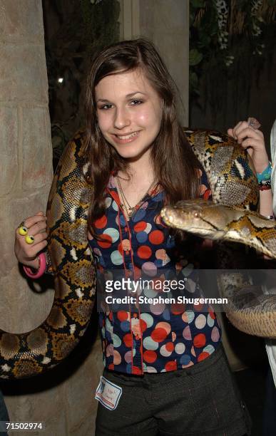 Actress Erin Sanders holds a Anaconda Snake at the After Party forthe DVD Release "Choose Your Own Adventure: The Abominable Snowman" at the Star Eco...