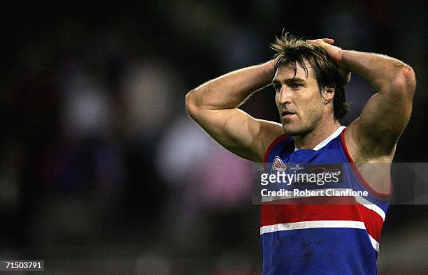 Scott West of the Bulldogs looks on dejected after the Cats defeated the Bulldogs during the round 16 AFL match between the Geelong Cats and the...