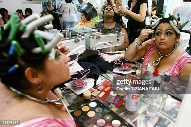 Contestants of the beauty contest "Miss Cicciona" get ready for the competition, held every year at Forcoli near Pisa in Tuscany, 23 July 2006. AFP...