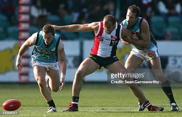 Michael Wilson for the Power, Fraser Gehrig for St Kilda and Darryl Wakelin for the Power in action during the round 16 AFL match between the St...