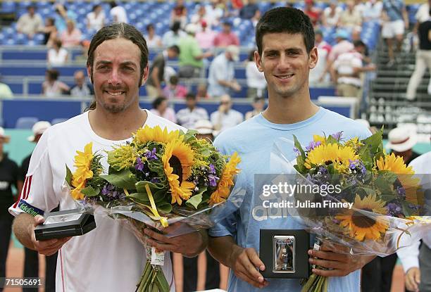 Novak Djokovic of Serbia & Montenegro and Nicolas Massu of Chile pose for photographers after Djokovic beat Massu in straight sets in the final...