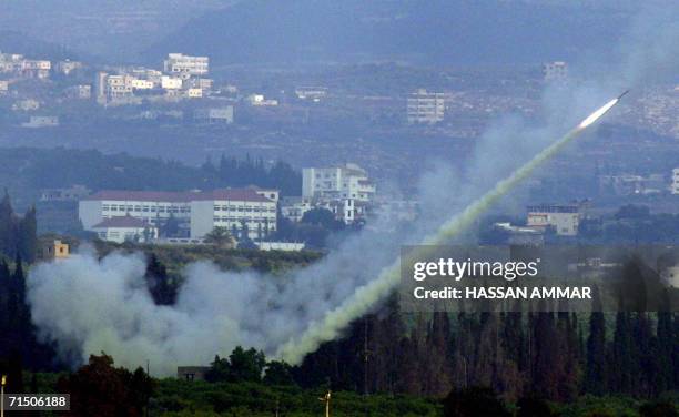 Hezbollah militants fire a missile from the southern Lebanese city of Tyre 23 July 2006. New rockets fired by the militia hit several towns today,...