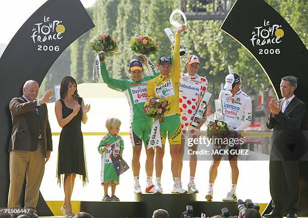 Yellow jersey USA's Floyd Landis celebrates with red-and-white polka dotted jersey Denmark's Michael Rasmussen , green jersey Australia's Robbie...