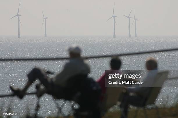 Cliff top view of Britain's largest offshore wind farm off the Great Yarmouth coastline on July 19, 2006 in Norfolk, England. The 30 turbines cost...