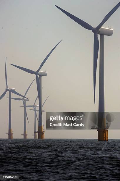 Group turbines from Britain's largest offshore wind farm stand off the Great Yarmouth coastline on July 19, 2006 in Norfolk, England. The 30 turbines...