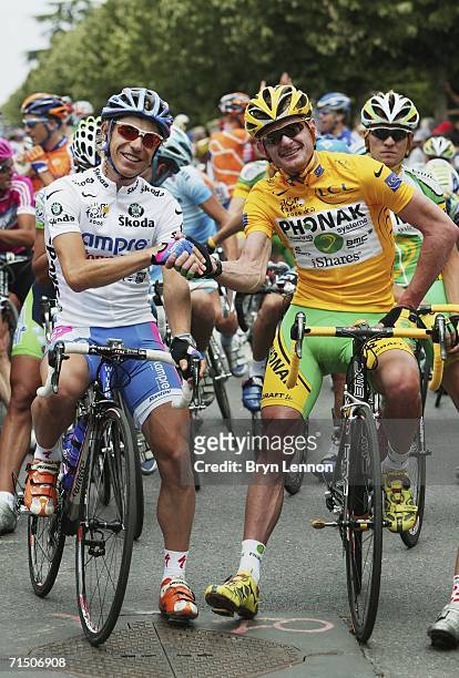 Damiano Cunego of Italy and Lampre poses with Floyd Landis of the USA and Phonak at the start of the final stage of the 93rd Tour de France, on July...