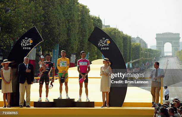 Floyd Landis of the USA and Phonak , Oscar Pereiro of Spain and Caisse d'Epargne and Andreas Kloden of Germany and T-Mobile stand on the podium after...