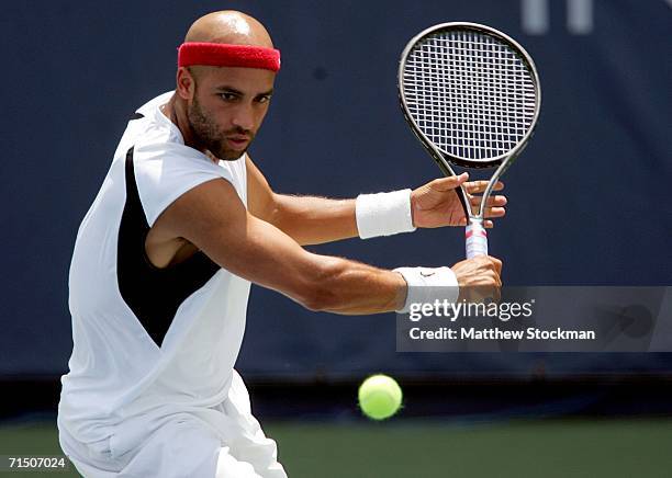 James Blake returns a shot to Andy Roddick during the final of the RCA Championships July 23, 2006 at the Indianapolis Tennis Center in Indianapolis,...