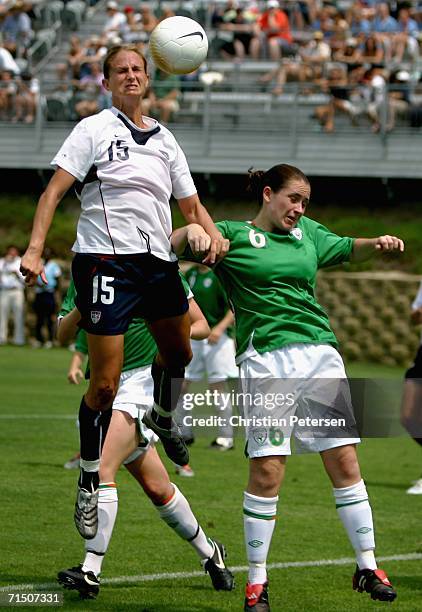 Marci Miller of Team USA jumps for a header over Sonya Hughes of Team Ireland during the international women's soccer game held on July 23, 2006 at...