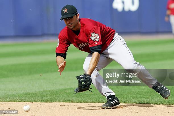 Second baseman Chris Burke of the Houston Astros fields a ball against the New York Mets on July 23, 2006 at Shea Stadium in the Flushing...