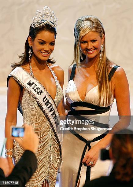 Miss Puerto Rico Zuleyka Rivera Mendoza poses with show host Nancy O'Dell on stage after being named Miss Universe during the Miss Universe 2006...