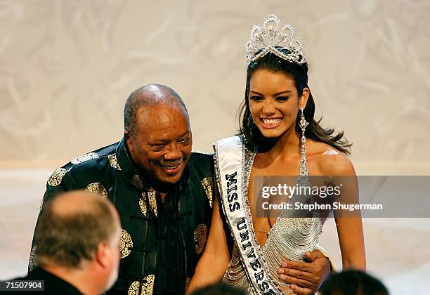 Miss Puerto Rico Zuleyka Rivera Mendoza poses with Quincy Jones on stage after being named Miss Universe during the Miss Universe 2006 pageant at the...