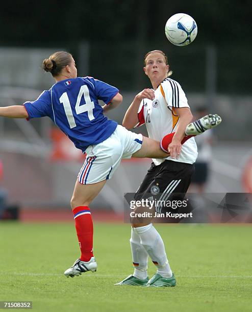 Eugenie Le Sommer of France tackles Josephine Schlanke of Germany during the Women's U19 Europen Championship match between Germany and France at...