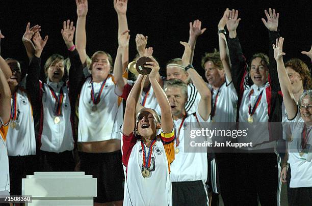 Nadine Kessler of Germany holds the trophy aloft after the Women's U19 Europen Championship match between Germany and France at Stadium Neufeld on...