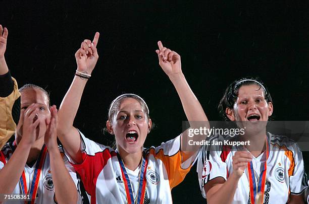 Babett Peter , Anna Blaesse and Ann-Christin Angel of Germany celebrate after winning the Women's U19 Europen Championship match between Germany and...